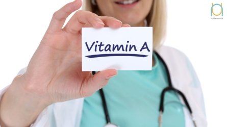 A Doctor is holding a picture that signifies the importance of keeping your vitamin A levels in good measure in order to cure vitamin A deficiency.