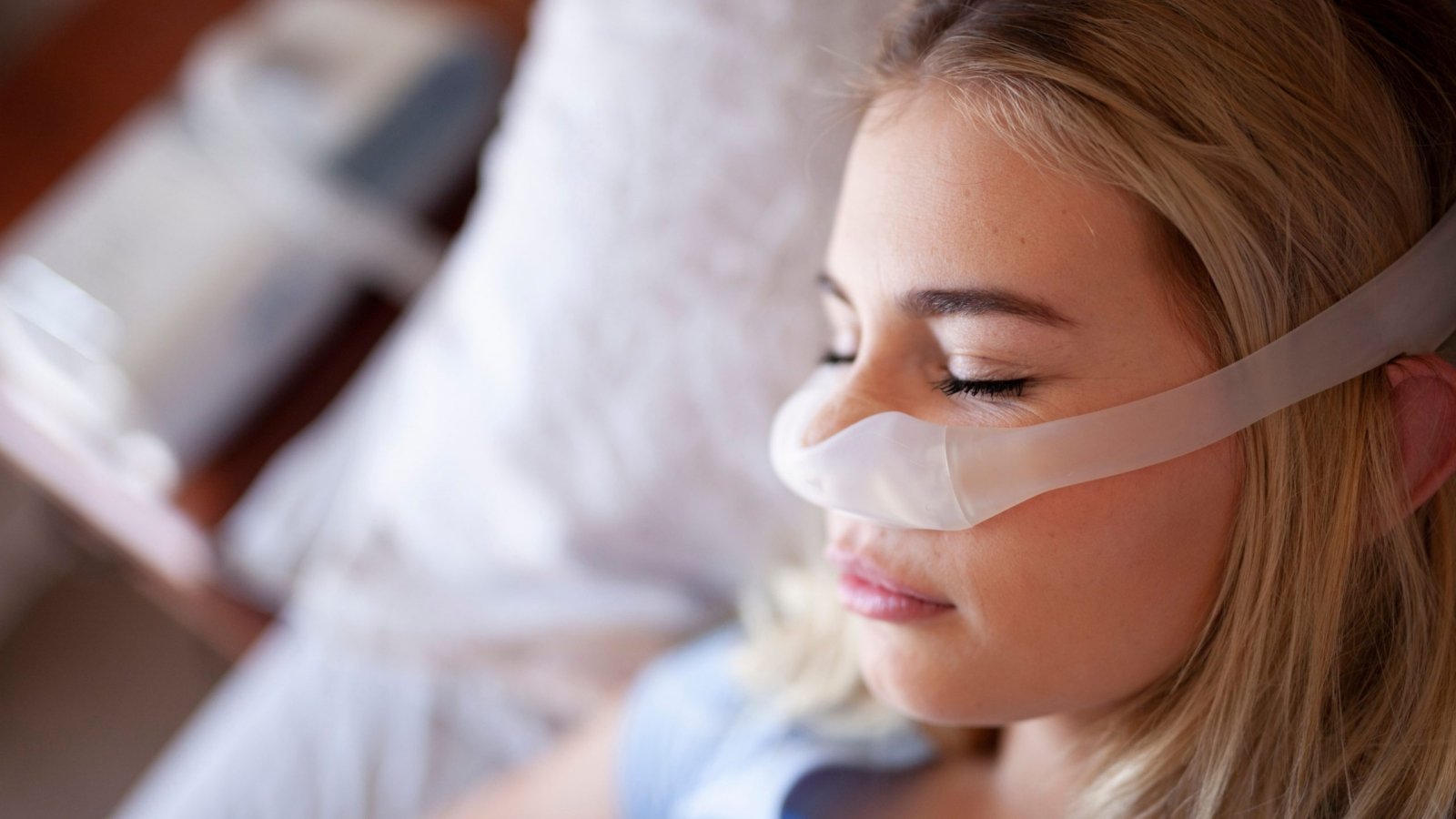 An Image of a patient sleeping with a CPAP machine for sleep apnea.