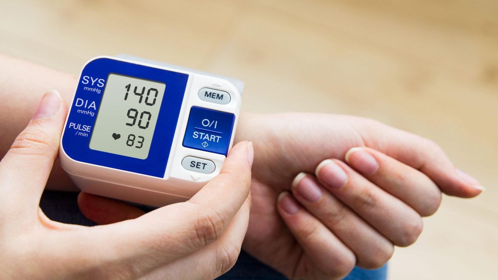 A woman checking to see if she has high blood pressure.